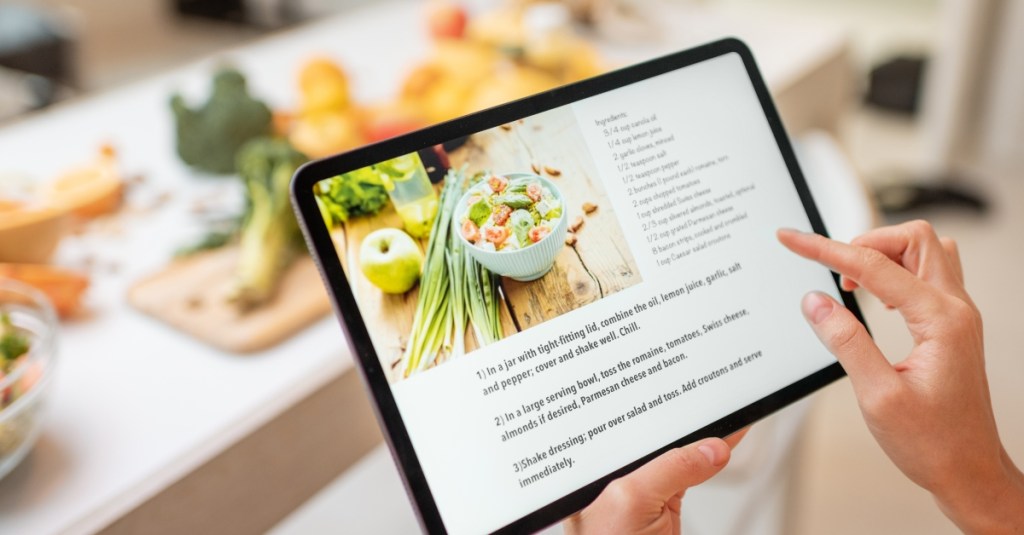 Dietitian client reading recipe on tablet